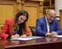 Sergei Korneyev, Deputy Head of the Federal Agency for Tourism, and Zarina Doguzova, Head of the Federal Agency for Tourism (Rostourism) sign documents during the plenary session “Arctic tourism, unique features and development prospects” at the Accessible Arctic forum in St. Petersburg