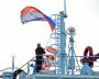 A Russian national flag is raised aboard the Akrtika nuclear icebreaker during its launching ceremony in the northern city of Murmansk, Russia