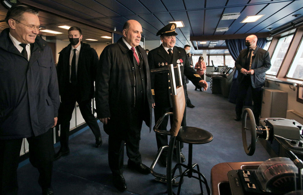 Russian Prime Minister Mikhail Mishustin, in center, Rosatom State Corporation CEO Alexei Likhachev, left, and Captain of the nuclear ice-breaker Arktika Alexander Spirin examine the Akrtika nuclear icebreaker during its launching in the northern city of Murmansk, Russia