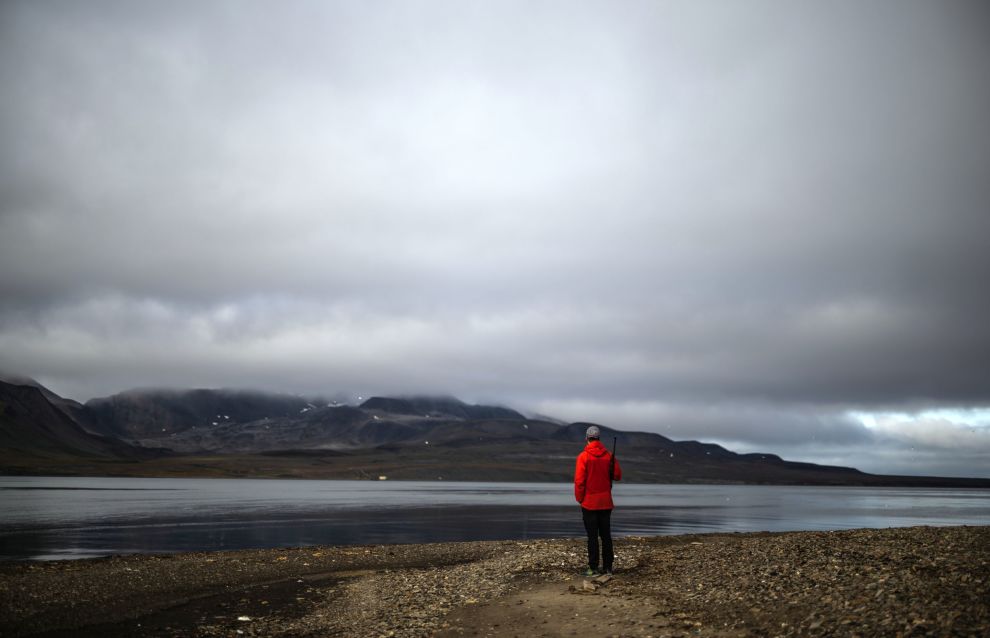 A man is seen on an island near the Barentsburg settlement on the Svalbard archipelago, Norway