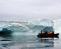 Tourists view the icebergs near Champ Island from inflatable Zodiac boats, Franz Josef Land