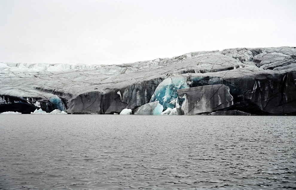 Chips on the glacier’s slope reveal the mystery of its name, Blue Glacier. Og Bay