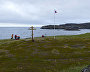 Polar Expedition Gallery participants and Center for Marine Studies specialists erect a memorial cross and a flag pole with the Russian tricolor in honor of the centenary of the return of the Sedov and Brusilov expeditions at Rynda (Kola Peninsula)