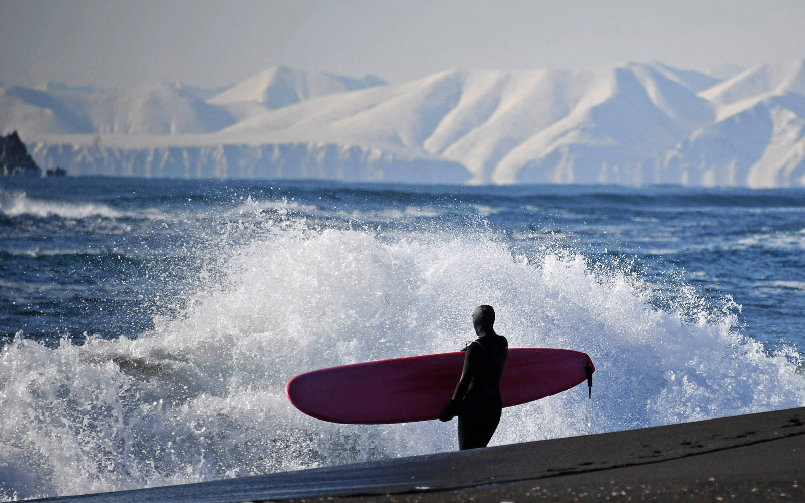 A surfer on the Khalaktyrsky Beach