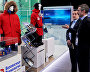 Forum participants at the stands of the companies Safe Technologies Industrial Group, left, and Moderam during the 9th International Forum The Arctic: Today and the Future, in St. Petersburg