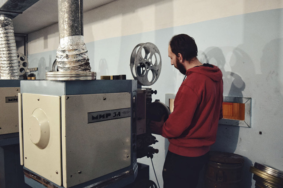 Stanislav Schubert works with Mir movie projectors